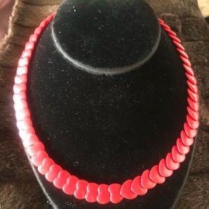 Fashion jewelry red hearts lucite necklace.